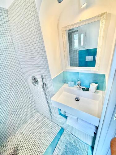 a bathroom with a sink and a shower at Santiago vacation home in Positano in Positano