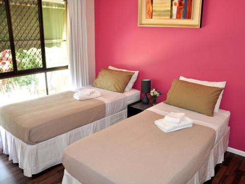 Cama o camas de una habitación en TL Warmest Homestay