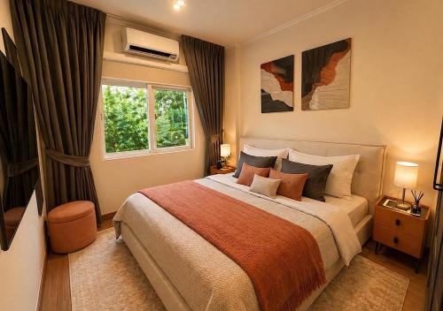 a bedroom with a large bed and a window at SvoyLuX Primo 3BR Gated House Near Pier and Muay Thai Street in Phuket