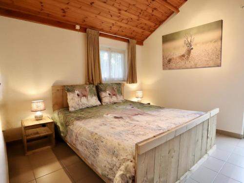 a bedroom with a bed in a room at Coeur de Biche in Rendeux
