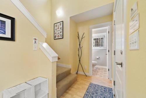 a hallway with stairs leading to a bathroom at Becalmed MCA#1653 in Manzanita