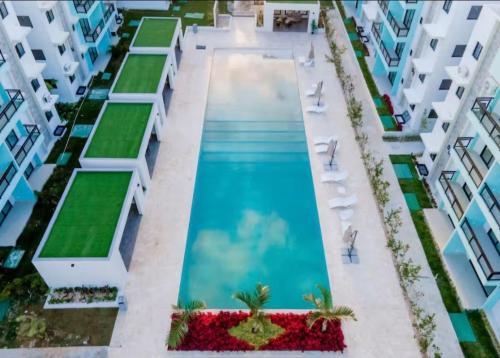 an overhead view of a swimming pool in a building at Dominican paradise in Punta Cana