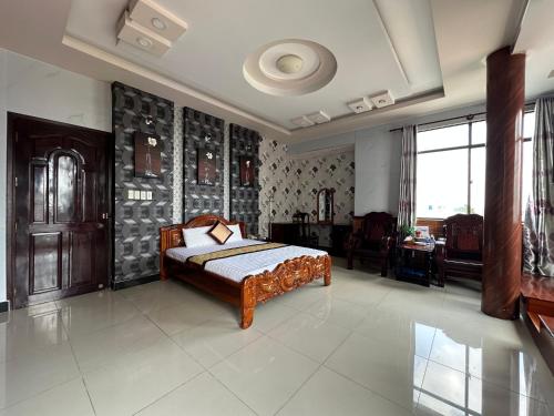 a bedroom with a bed in a room at SEAMOON Hotel in Rạch Giá