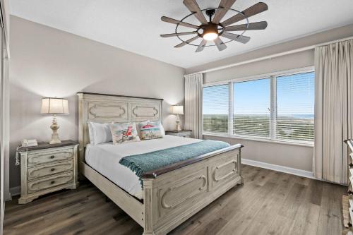 a bedroom with a bed and a ceiling fan at TOPS'L Summit 809 2 Bedroom in Destin