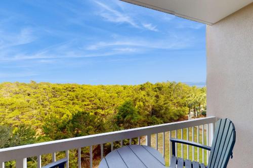 a balcony with a chair and a view of the ocean at 4th-Floor Condo with Shared Pool and WiFi in Destin