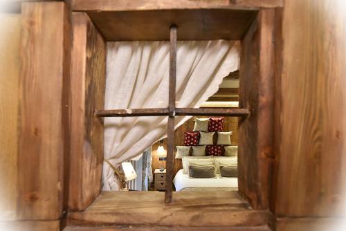 a view of a bedroom with a bunk bed at Hotel La Rouja in Champoluc