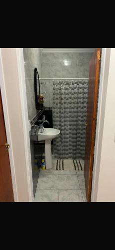 a bathroom with a sink and a shower at Cabaña Kuarahy in Empedrado