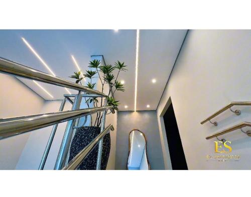 a staircase in a building with plants on it at Hotel El Shaddai in Pontes e Lacerda