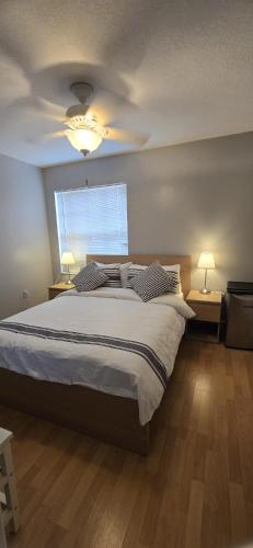 a bedroom with a large bed and a window at Across from Sawgrass Mall- Next to Amerant Bank Arena in Sunrise