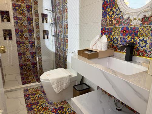 a bathroom with a toilet and a shower at Best House Luang Prabang in Luang Prabang