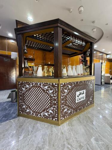 a display case in a room with vases on it at شقق مباركية in Rafha