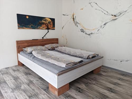 a bedroom with a bed in a room at Apartmán U Tří Palem in Břeclav