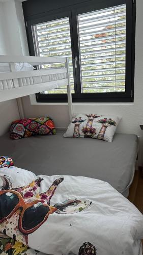 a bedroom with two beds and a bunk bed at Bergperle in Grächen