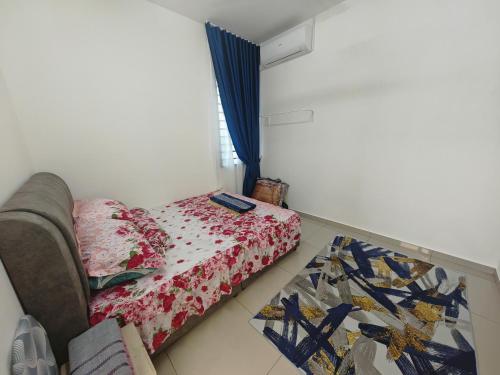 a small bedroom with a bed and a window at Homestay Amna DShorea in Port Dickson