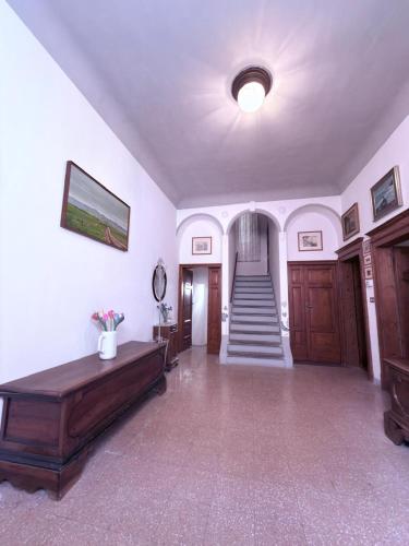 a large room with a hallway with a staircase at CupraScìScì in Cupra Marittima