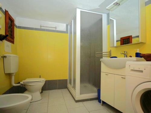 a bathroom with a toilet and a sink and a shower at Casa Paola 5 Terre in Biassa