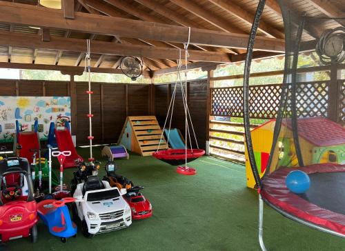 a room with many different kinds of play equipment at Camping Castello in Neos Marmaras