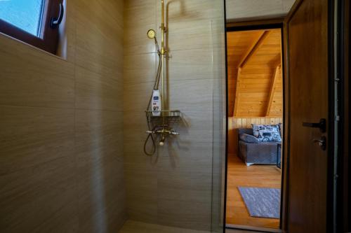 a door leading into a bathroom with a room at Rural Resort Tron Gold in Plužine