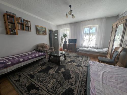 a living room with a couch and a table at Agroturystyka Szerokopaś in Nidzica