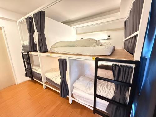 a room with two bunk beds and a bed at THE BEST ONE CHIANG MAI in Chiang Mai