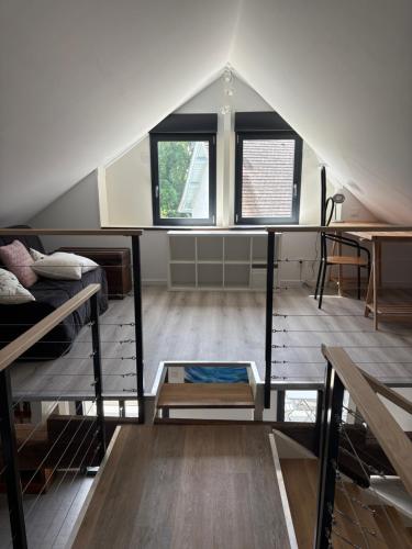 a room with two bunk beds and two windows at La Fraternelle in Ceyzérieu