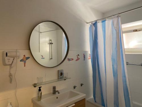 a bathroom with a mirror and a sink at The Mint in Rovinj