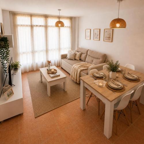 a living room with a table and a couch at Alojamiento Ultreia - Estorde in Cee