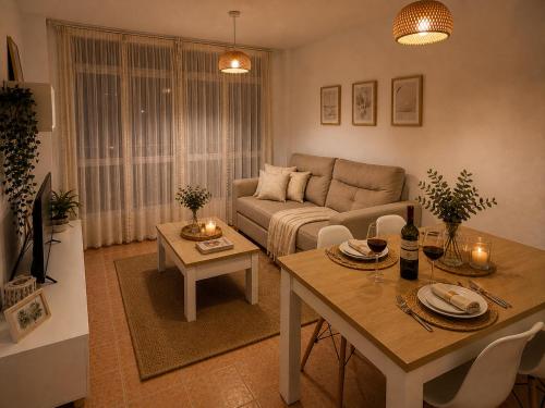 a living room with a couch and a table at Alojamiento Ultreia - Estorde in Cee