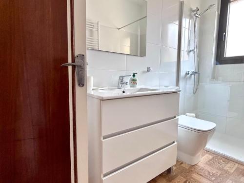 a bathroom with a sink and a toilet at Caliu Tremp in Tremp