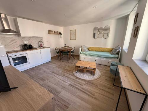 a living room with a couch and a table at Umalas studio in Orange