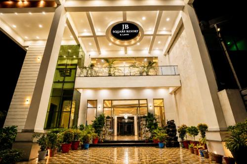 a lobby of a hotel with potted plants at Hotel JB Square Ayodhya Near Ram Mandir, Airport & Ayodhya Cantt in Ayodhya