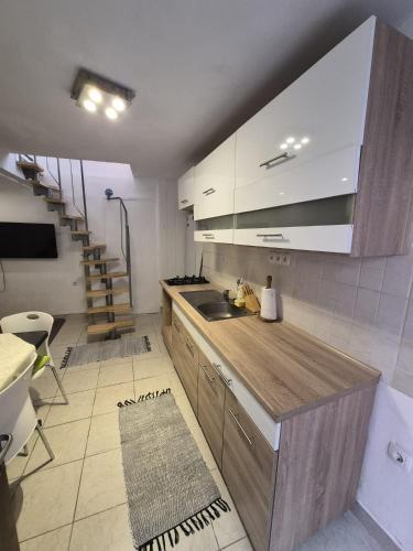a kitchen with a sink and a counter top at Apartment Sidro in Cres