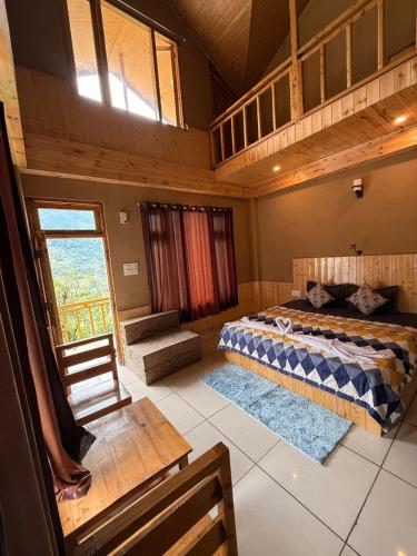 a bedroom with a bed and a loft at Sparrow Whisper in Jibhi