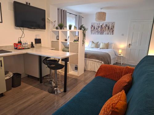 a room with a desk and a bed and a desk and a computer at The Éire Escape Countryside Studio near Newgrange & Dublin in Slane
