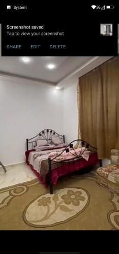 a bedroom with a bed and a carpet at فيلا سالم الاشقر in Amman