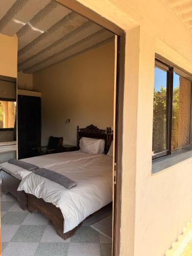 a bedroom with a large bed in a room at Executive Manica Hotel in Chimoio