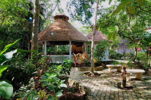 a gazebo in the middle of a garden at Tingalaya's Retreat in Negril