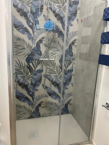 a shower in a bathroom with a wall at pinetadamare in Porto SantʼElpidio
