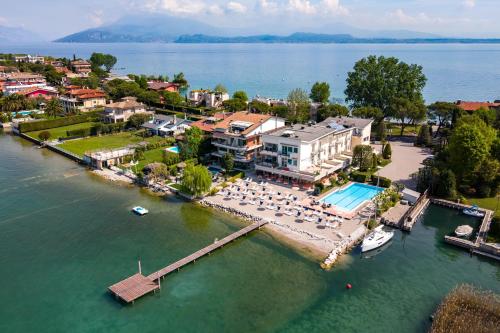 an aerial view of a resort on the water at Hotel Tre Vele in Sirmione