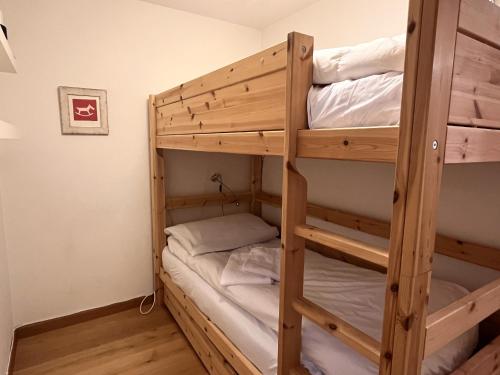 a couple of bunk beds in a room at Chesa Silvretta - Celerina in Celerina