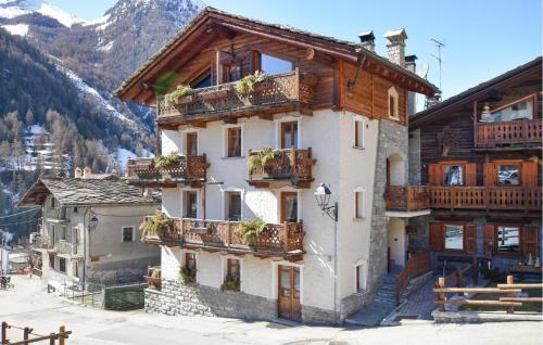 a building with balconies on the side of it at Amazing Apartment In Cogne in Cogne