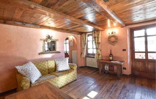 a living room with a couch and a table at Amazing Apartment In Cogne in Cogne