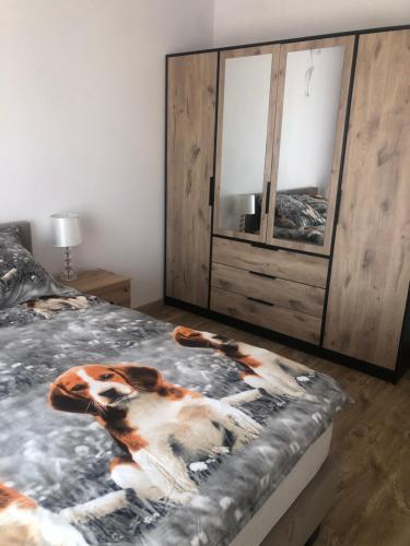 a bedroom with a horse blanket on a bed at Przystań dla rodziny in Tarnów