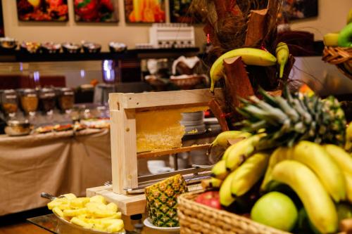a bunch of bananas and other fruits on a counter at LivInn by Trotmannia in Dortmund