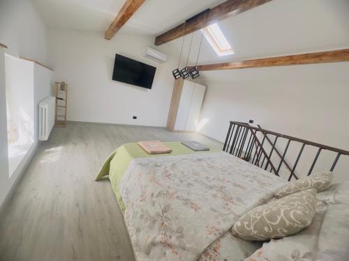 a bedroom with a bed with a book on it at La Casa Rossa II in Verona