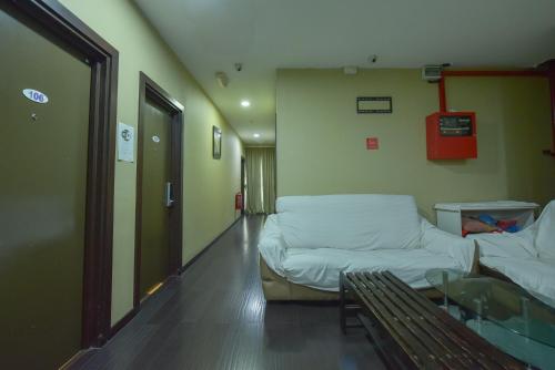 a hospital room with a couch and a table at SMC Hotel Seksyen 13 in Shah Alam