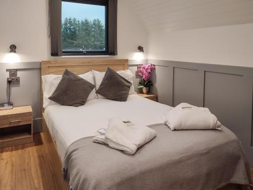 a bedroom with two beds with white pillows at Ben Aigan - Ukc6027 in Newmill