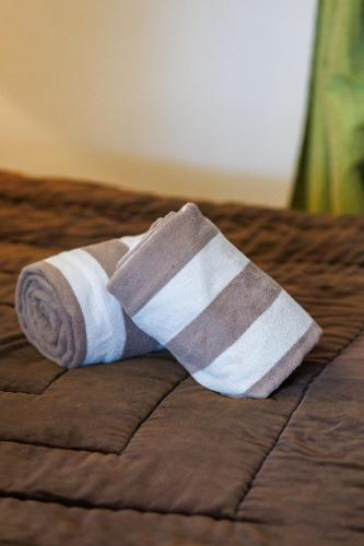 an injured sock sitting on top of a bed at Mas de l'Olivette in Cotignac