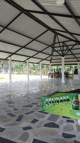a green skateboard sitting on the floor of a tent at Quinta Campestre Bella Vista in Acacías