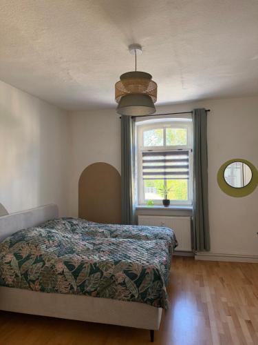 a bedroom with a bed and a window at Dianas Ferienwohnung 2 in Feldberg